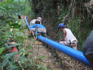 Installation of HDPE pipes by community members for their irrigation system