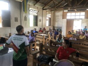 Forester Jefferson A. Himson begins his lecture on coffee rejuvenation techniques.