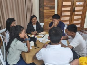 Participants actively engage in group discussions during the workshop activities.