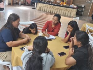 Participants actively engage in group discussions during the workshop activities.