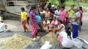 Participants store the prepared organic feeds after completing the mixing process.