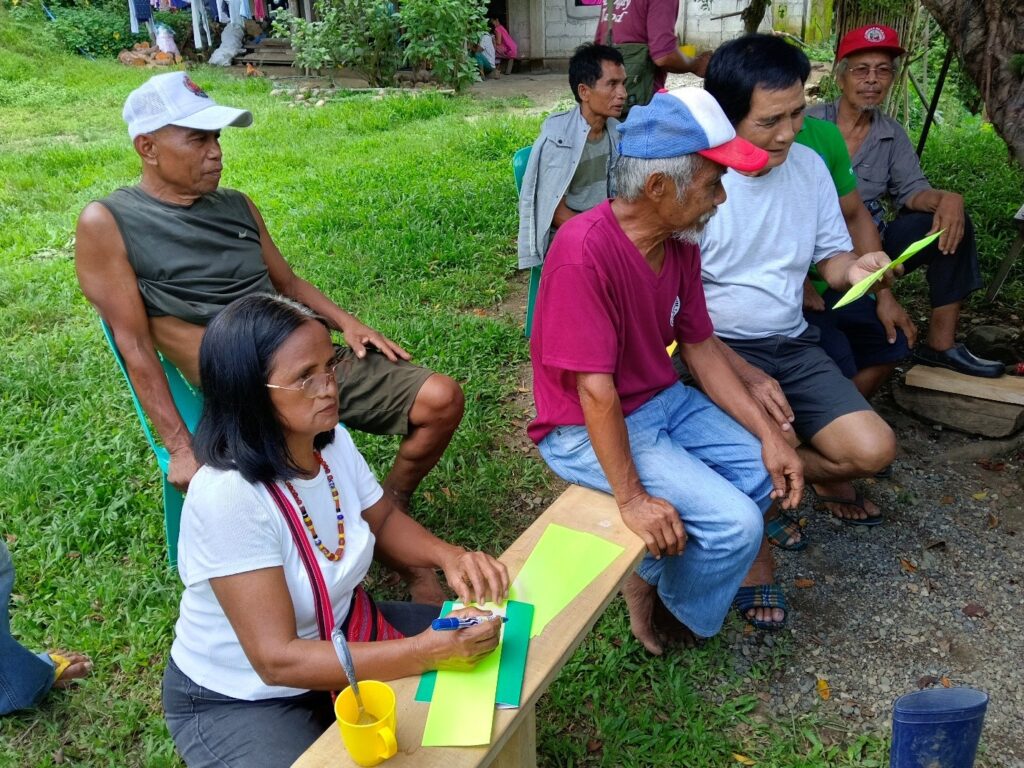 Participants listen attentively and take notes during the training session.